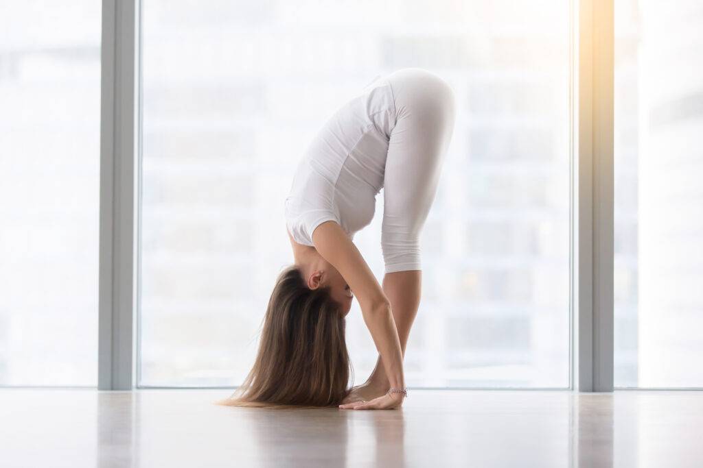 Standing Forward Bend – Simple yoga stretch to release tension after work